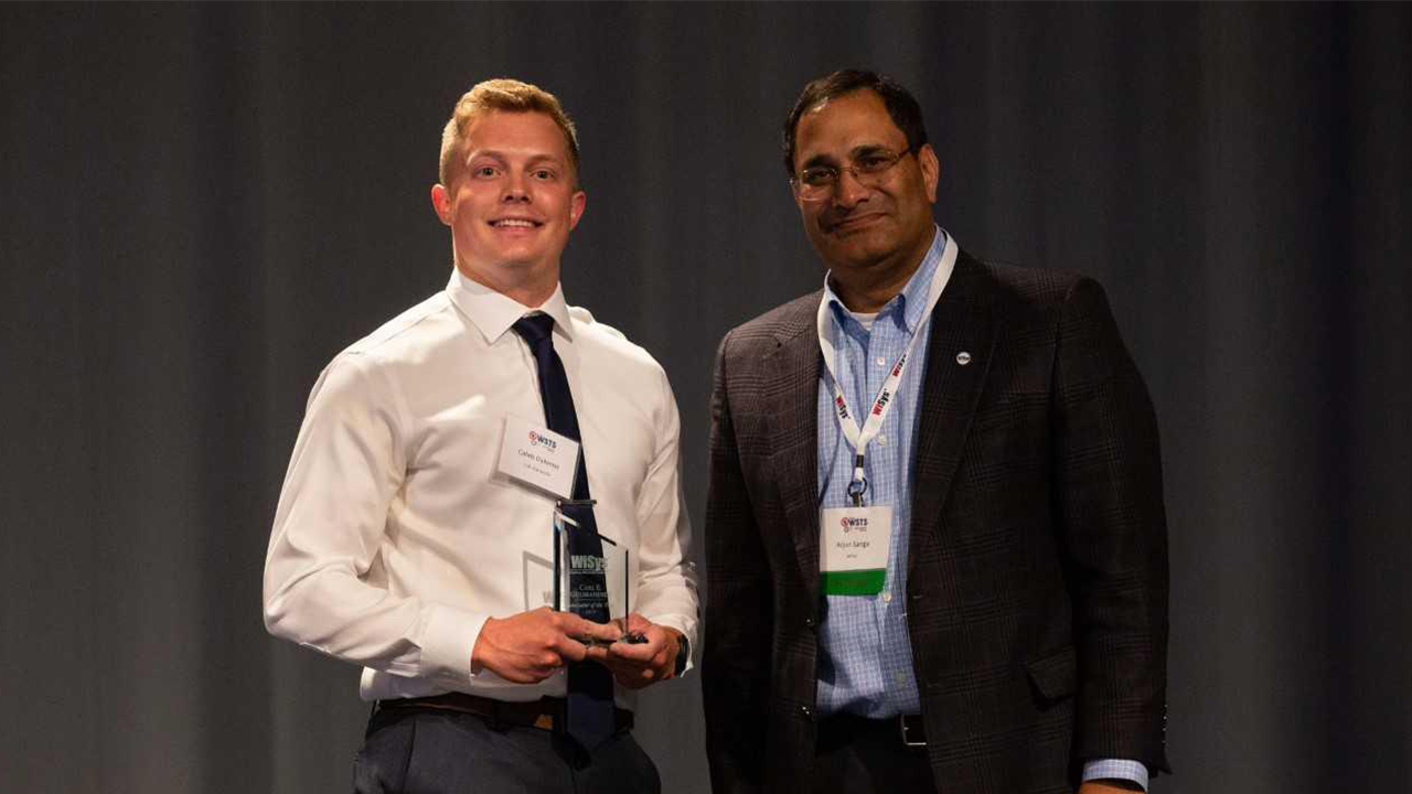 Caleb Dykema (left) is pictured with WiSys President Arjun Sanga.