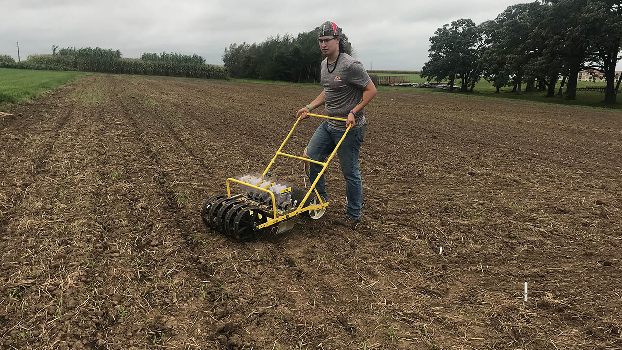 Hunter Jesberger plants 10 varieties of pennycress at the Lancaster Agricultural Research Station.