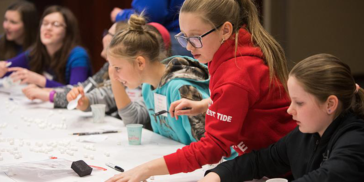 students doing an experiment in Pioneering Your Future in STEM