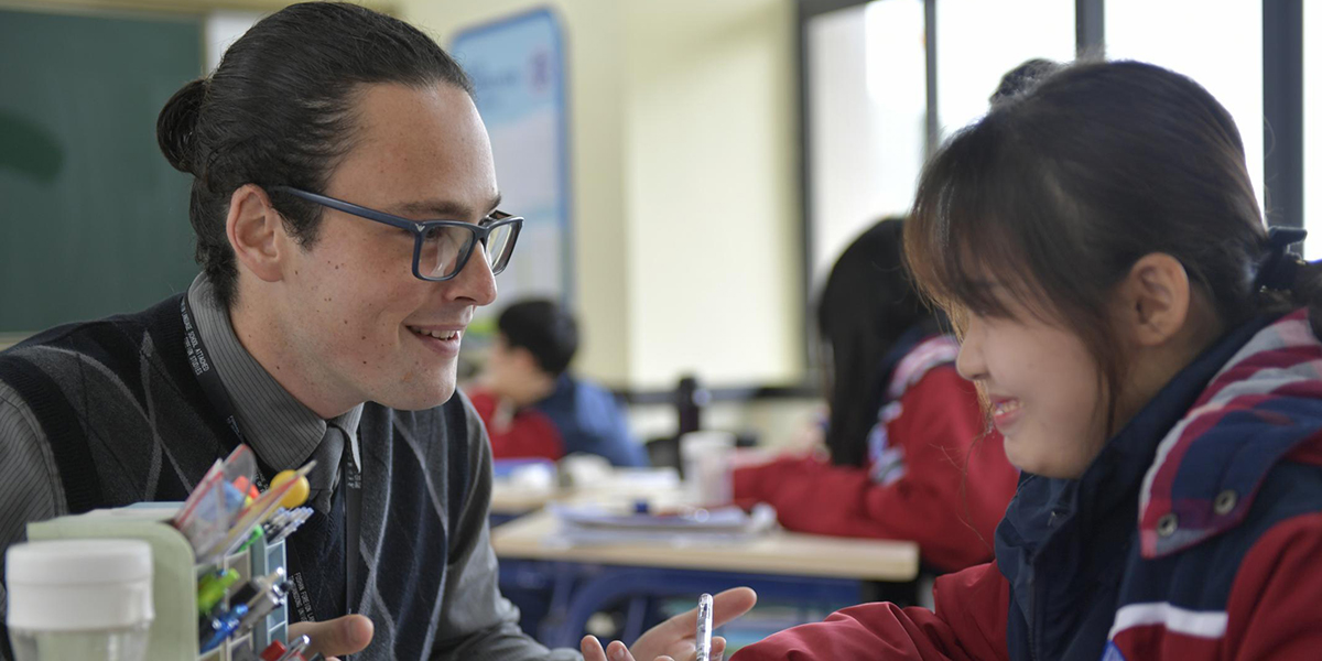 Charlie Schoenberg teaching at Guangwai-Pacelli High School