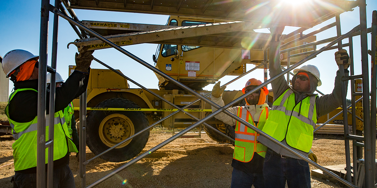 industrial studies students working on a construction site