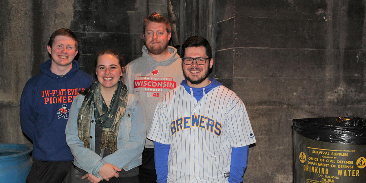 Students inside the coal storage room of the Platteville nuclear fallout shelter. The coal room was originally designed to store coal to heat the city hall's boiler and to heat the shelter.