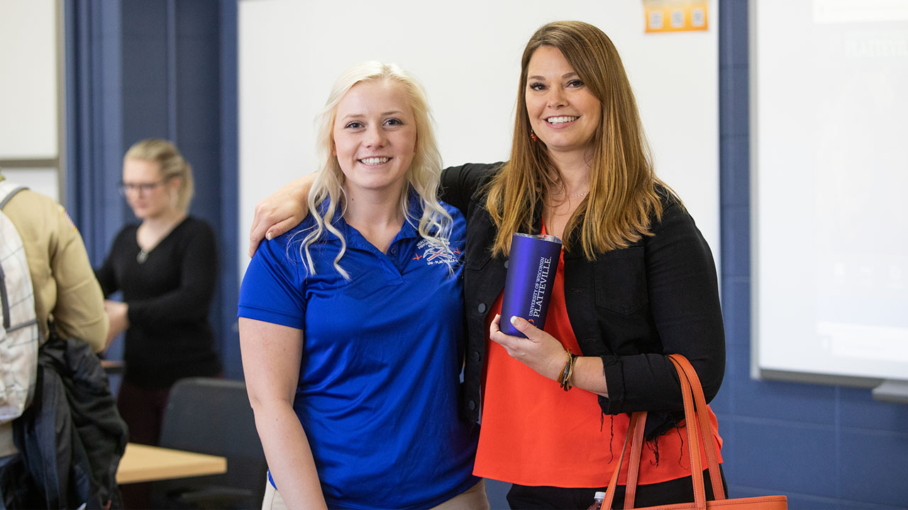 Katie Michel, CEO of Orange Shoe Personal Training and Lauren Swanson, event organizer enjoying the fruits of a great day.