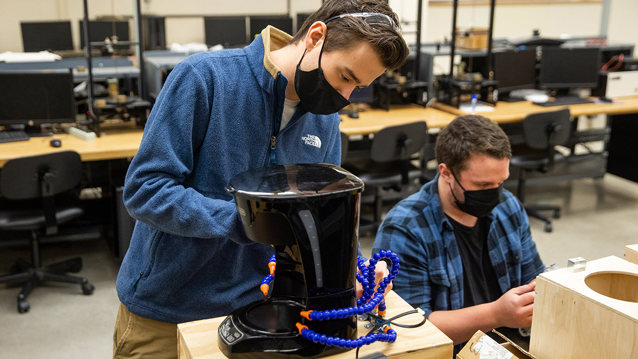 Team of students works on cooling device