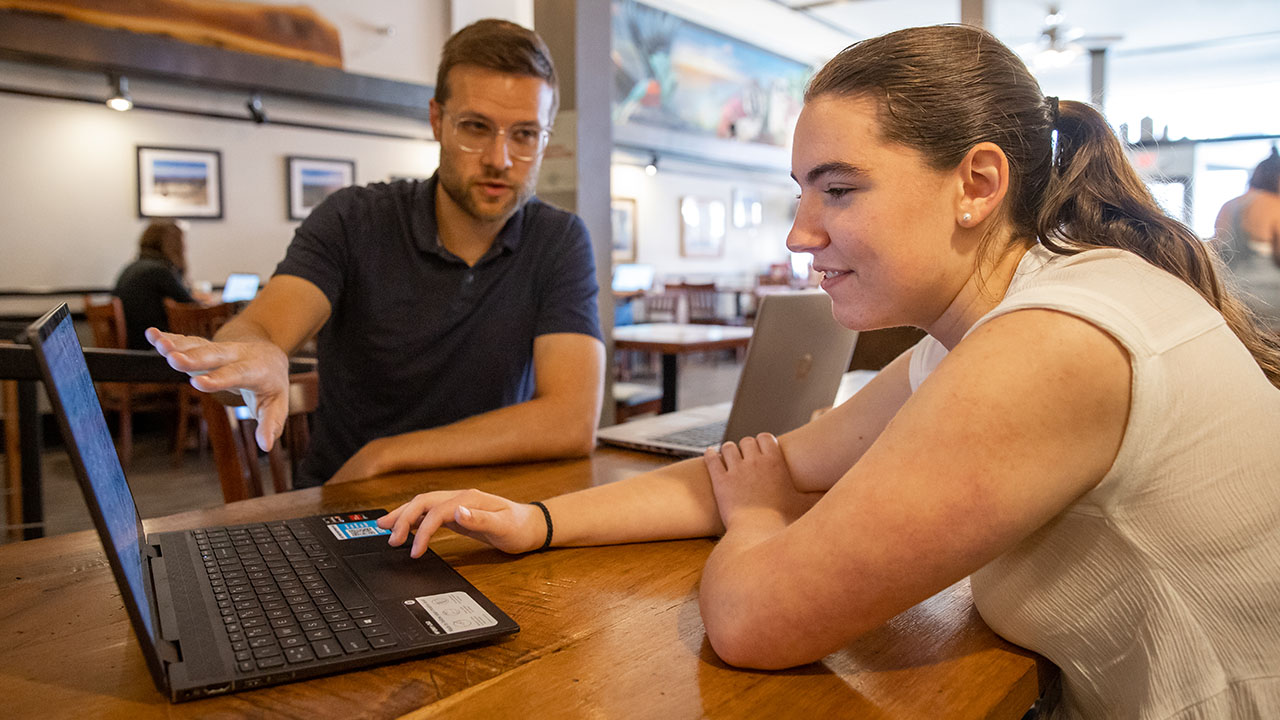 Kimberly Cummings meets with Dr. Alec Eshelman to discuss her research.