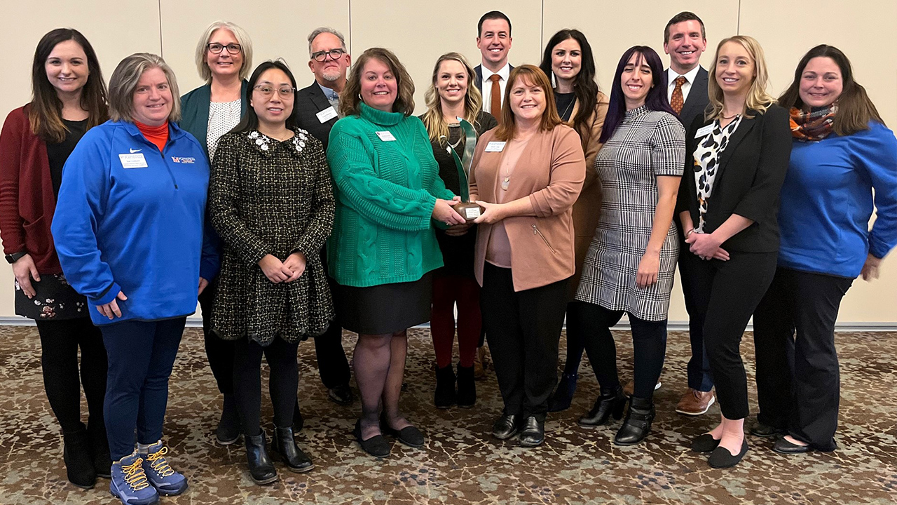 Foundation staff accepting award