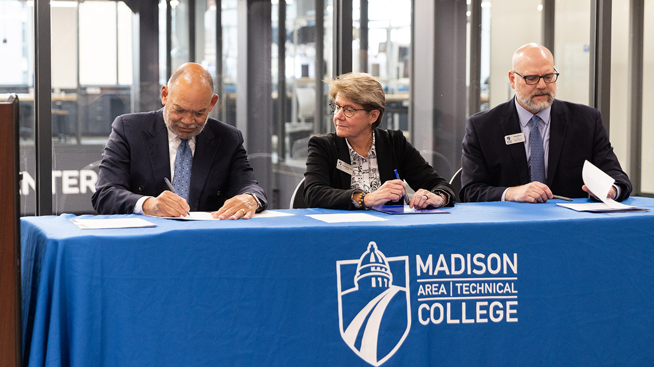 Signing ceremony with Madison College in Sesquicentennial Hall