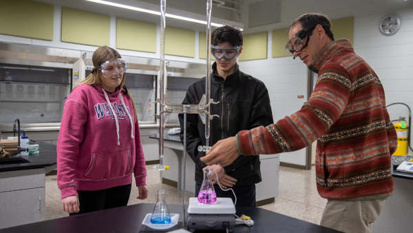 Dr. Stephen Swallen, professor of chemistry, works with students.