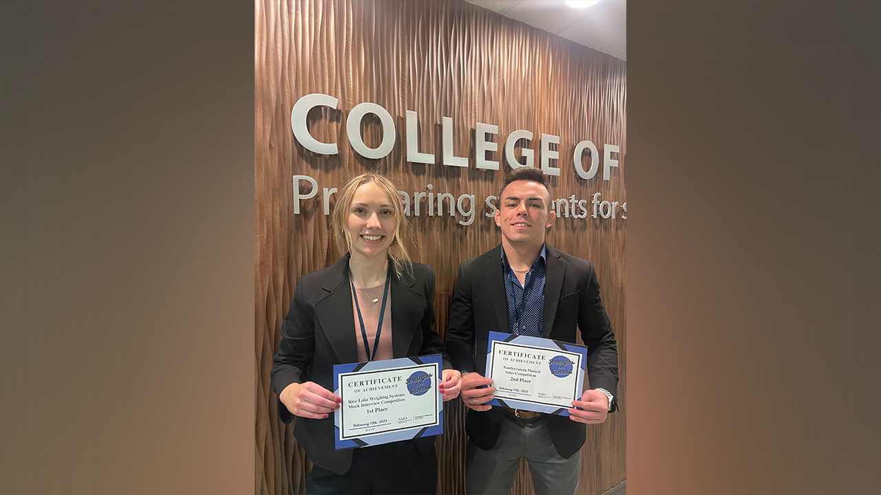 Seniors Dana Schmitz and Brock Parker earn awards at the UW-Eau Claire American Marketing Association 10th Annual Regional Conference.