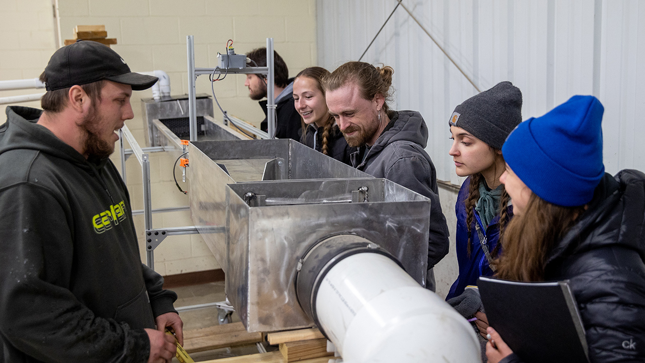 Students learn about flumes and how to determine runoff flow rates and volume from the edge of field monitoring sites. 