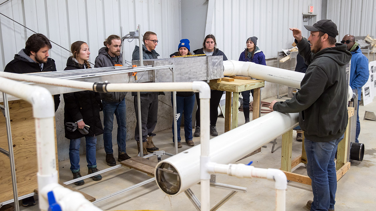 Students learn about flumes and how to determine runoff flow rates and volume from the edge of field monitoring sites. 