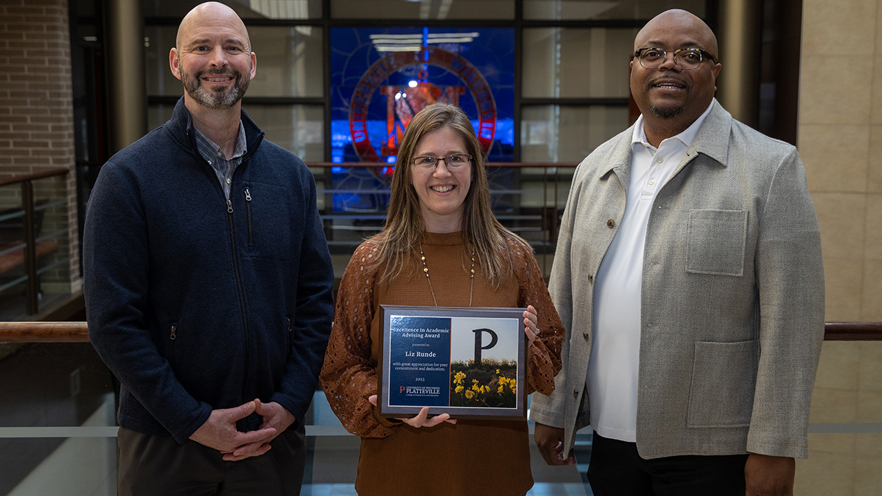 Elizabeth Runde, pictured with Interim Provost Wayne Weber (left) and Dean Hilton Kelly (right) 