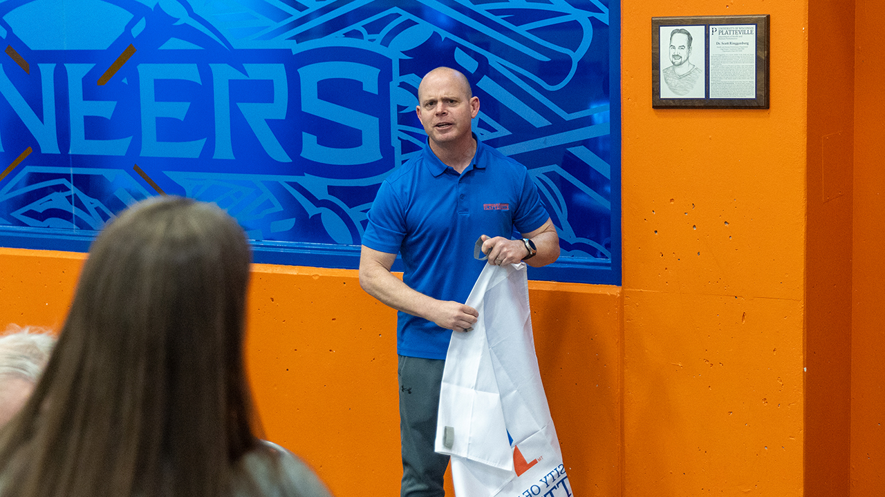 Tim Swenson, assistant professor of health and human performance, speaks at the dedication ceremony.