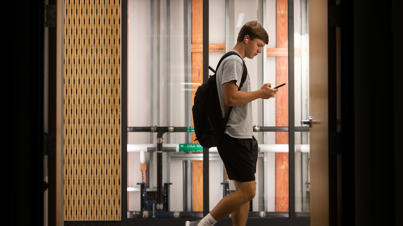 Student inside Sesquicentennial Hall