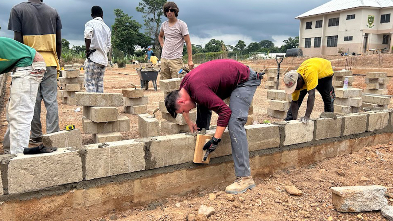 UW-Platteville Students worked alongside a local crew to construct the junior high school in Adumasa, Ghana.
