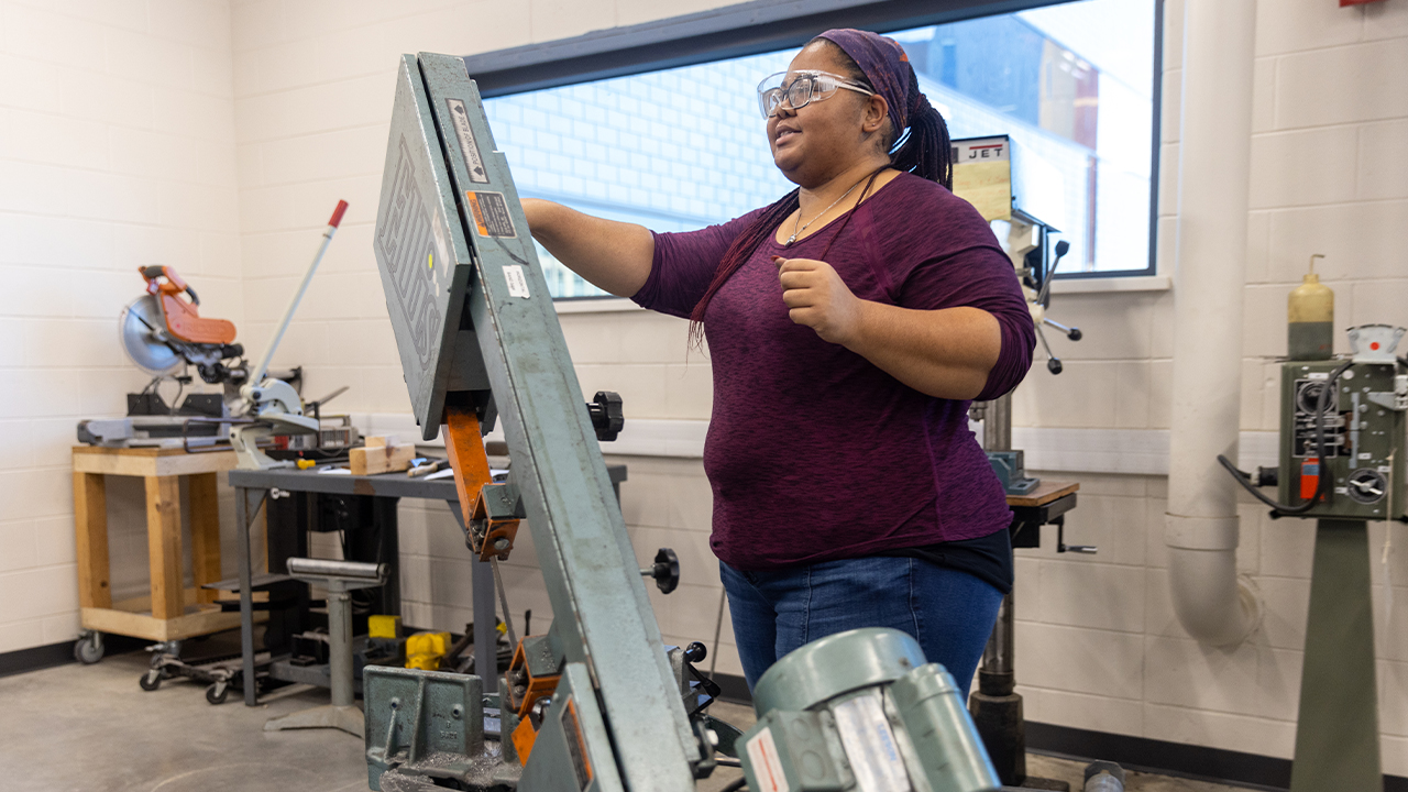 Hilliard working on the chair in the Huff Family Innovation Center on campus.