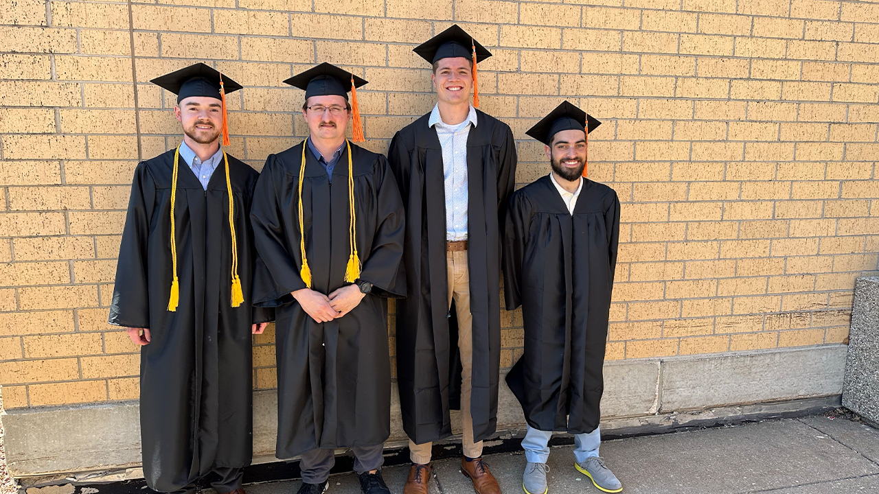 Mitchell Russell's Senior Design team at the Spring 2024 graduation. Pictured (left to right): Mitchell Russell, Andy Willadsen, Jesse Hartjes, and Alric Lopez.