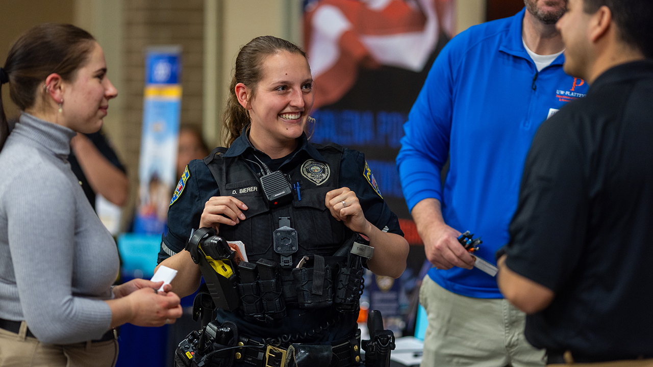 UW-Platteville alumna and Dubuque Patrol Officer Dakota Bierer sharing a smile and valuable insights with students.