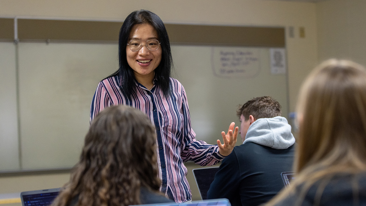 Dr. Xinghui Chen shares a moment with her marketing students, bringing real-world insight and enthusiasm to every discussion.