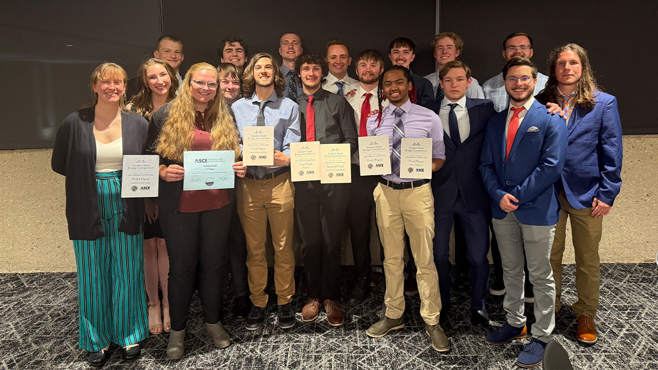 The Steel Bridge Team holding certificates that earned them the first place overall award.. 