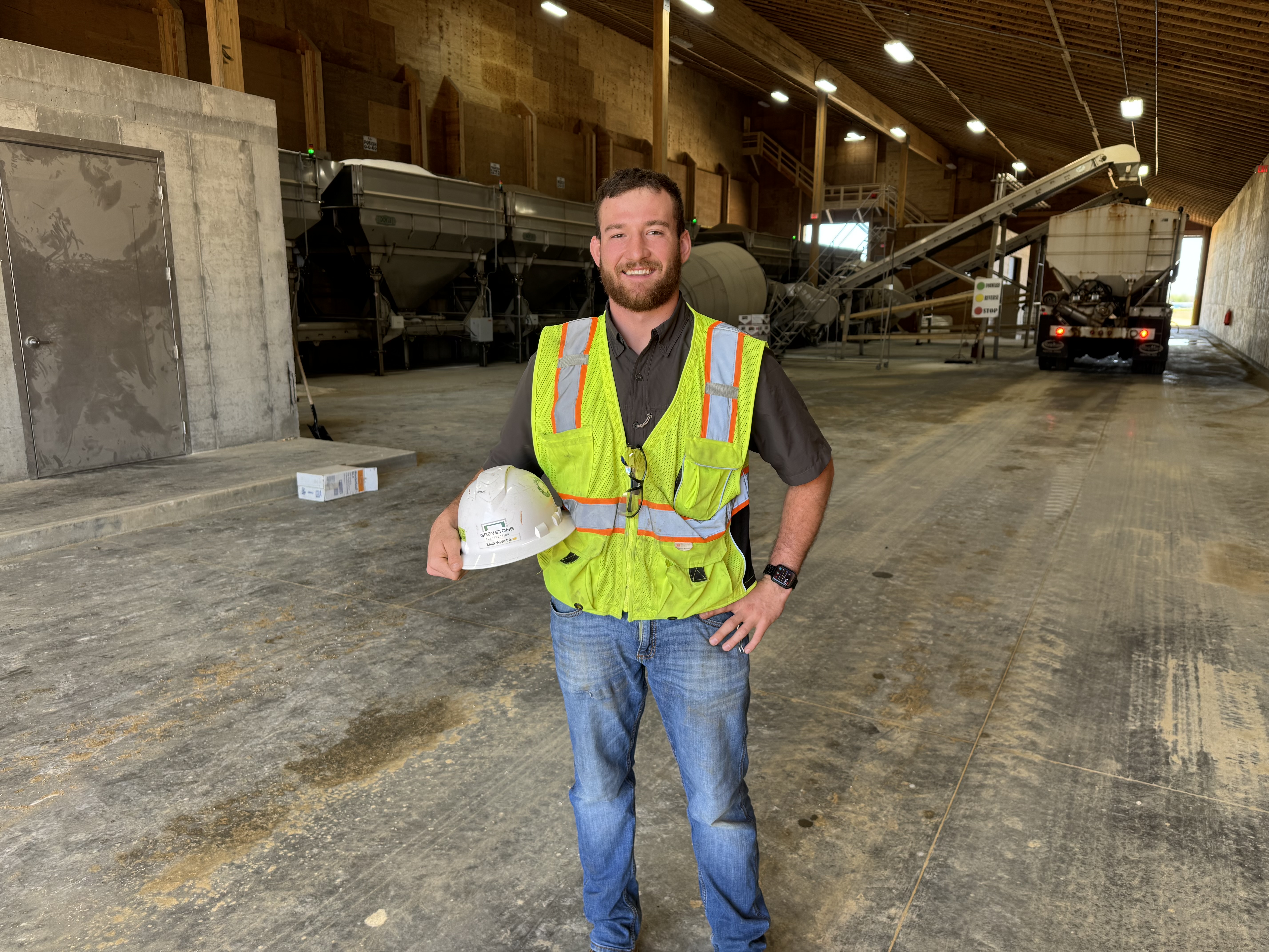 Alumnus Zack Wynstra in a new facility built by Greystone Construction for Premier Cooperative in Cuba City, Wisconsin.