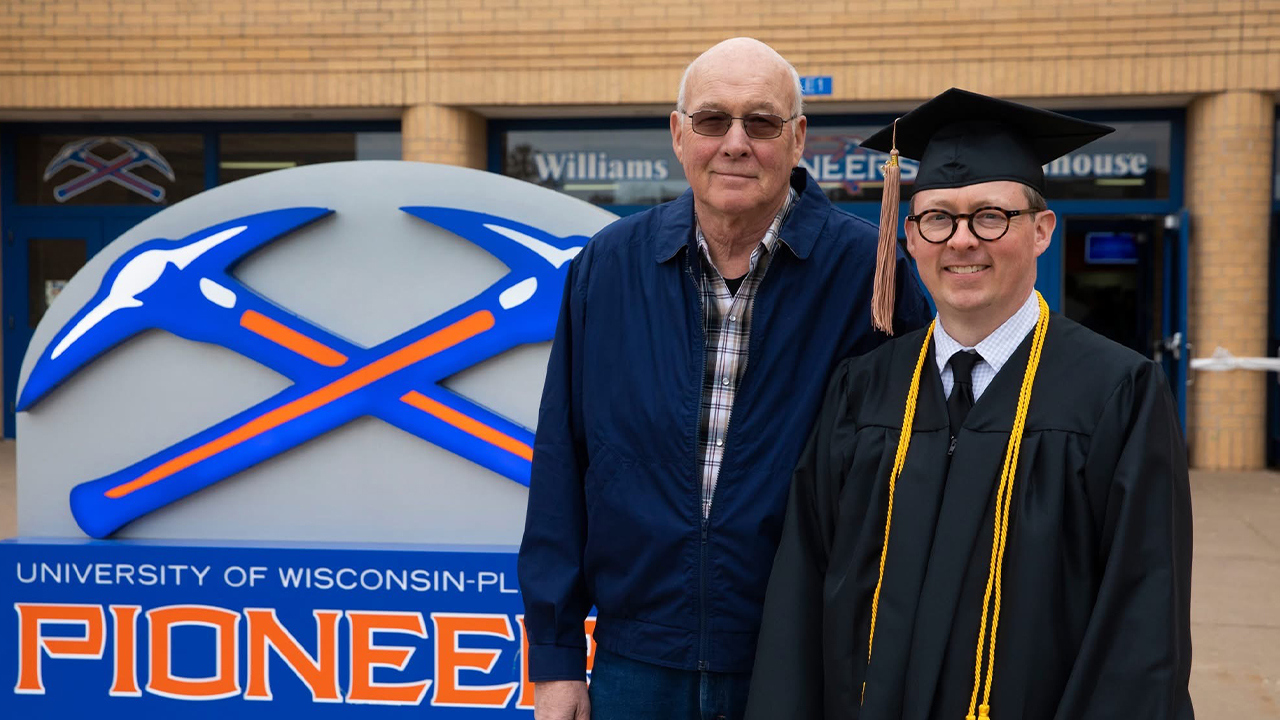 Jeff LaSee shares a proud moment with his father, Ray, on graduation day—a promise fulfilled years after Jeff first made his dad vow to be there.