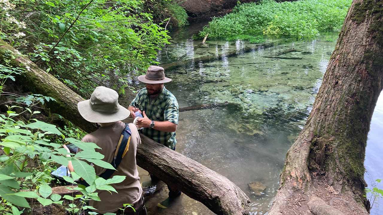 Conducting fieldwork to monitor springs in Southwest Wisconsin with research student Maggie Foster, following two years of collaborative study.