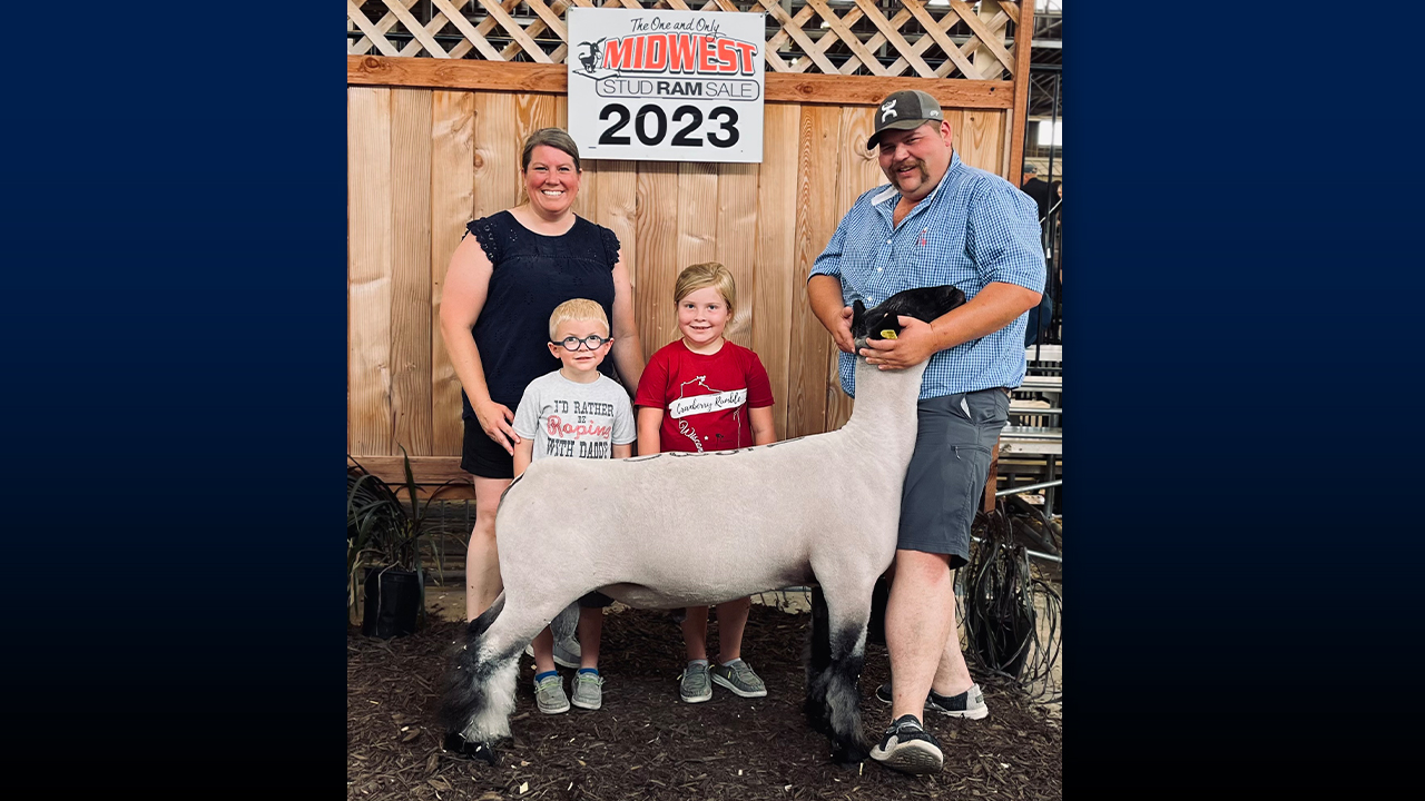 Bockenhauer with her family—Colt, Cora, and Dakota—after purchasing a new ram for the farm.
