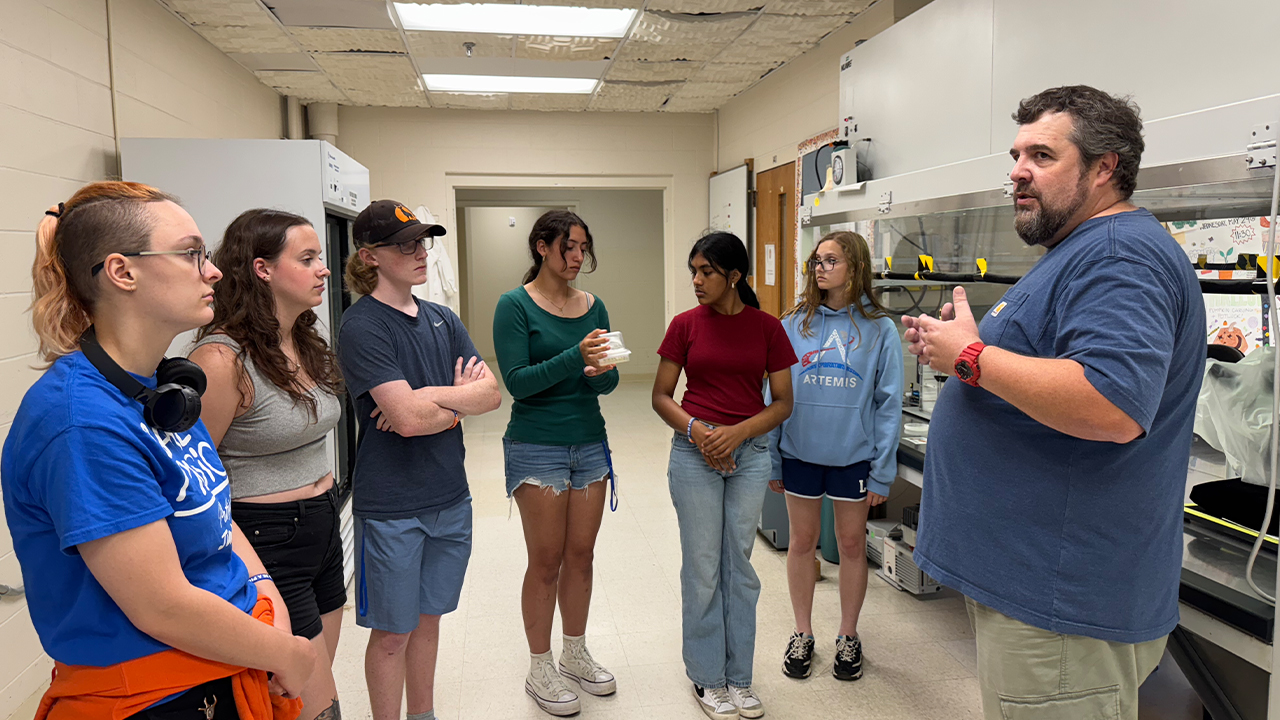 Students visited the Wisconsin Crop Innovation Center and learned about the steps involved in plant genetic transformation. Picture includes camp counselors Lillian Dalbey and Paige Atkinson, along with a scientist at WCIC.