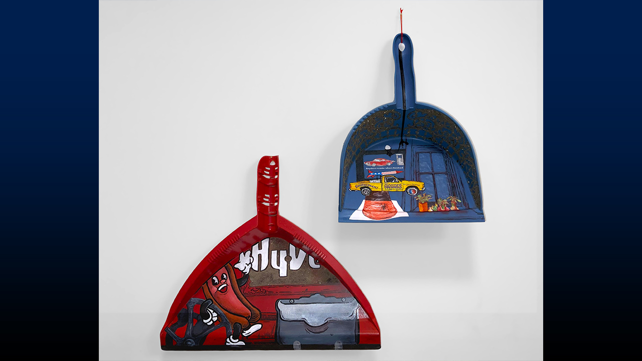 Mixed media dustpans created by Kobe Elixson and Zoё Couvillion.