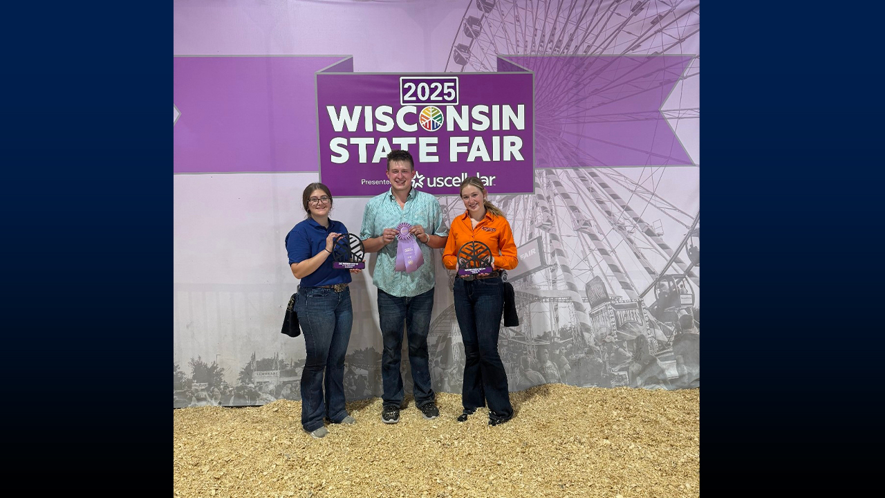 Gwynn Braden (May graduate), Brayden Peter and Sophia Daugherty at the Wisconsin State Fair with awards for Reserve Champion Berkshire Boar and Premier Berkshire Exhibitor.