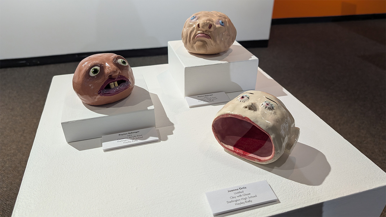 Ceramic heads created by Payton Belanger and Joanna Ortiz of Darlington High School are on display in the 2025 WRAP-Teen High School Art Show at Nohr Gallery.