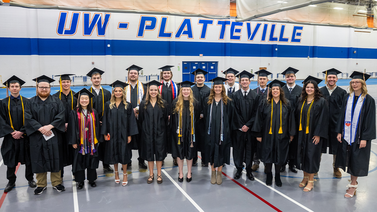 Happy graduates standing together. 