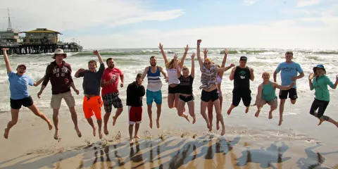 Students at the Pacific ocean in Santa Monica, California