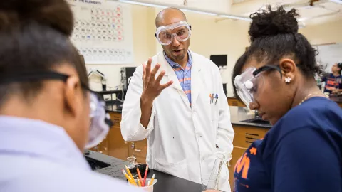 Raymond Pugh in lab with students