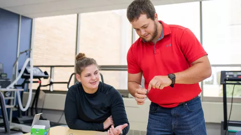 Dr. Ben Krings works with student