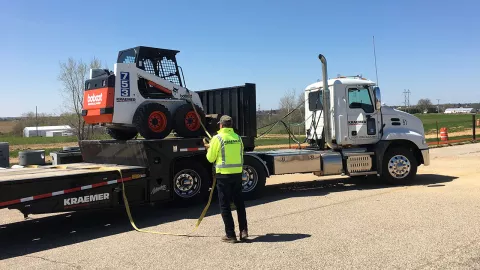 Kraemer Brothers donates skid steer