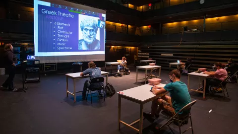 Dr. Ann Farrelly teaches classes in the theatre.