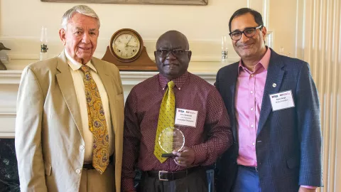 Dr. Obielodan receiving award