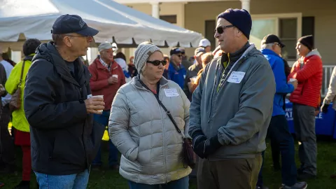 Alumni gathering in alumni tent