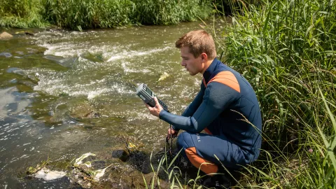 Biology student working in stream