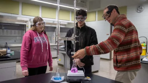 Dr. Stephen Swallen, professor of chemistry, works with students.