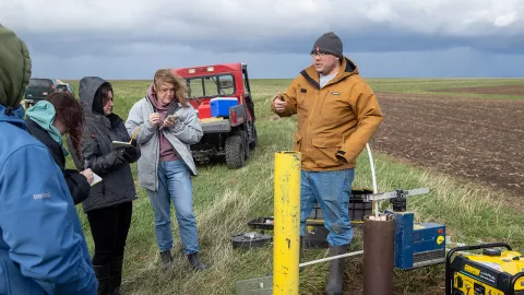 Students learn about the groundwater sampling network at Pioneer Farm and receive a demonstration on how to sample water from wells.