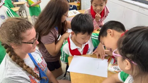 Teacher and students in classroom