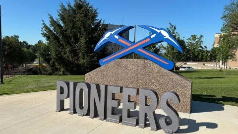 The Pioneers axe sign in front of Ullsvik Hall.
