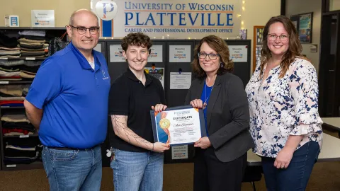 UW-Platteville Career and Professional Development Office Director Trapper Mitchell, sophomore Ava Seymour, Career Development Coordinator Jane Laufenberg and Career and Professional Development Office Administrative Assistant Tina Aloisi pose with Seymour's Pioneer's Edge:  A Career Readiness Adventure certificate.