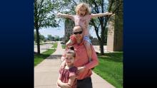 Frayer takes his daughters Nora and Eva for a walk around campus.