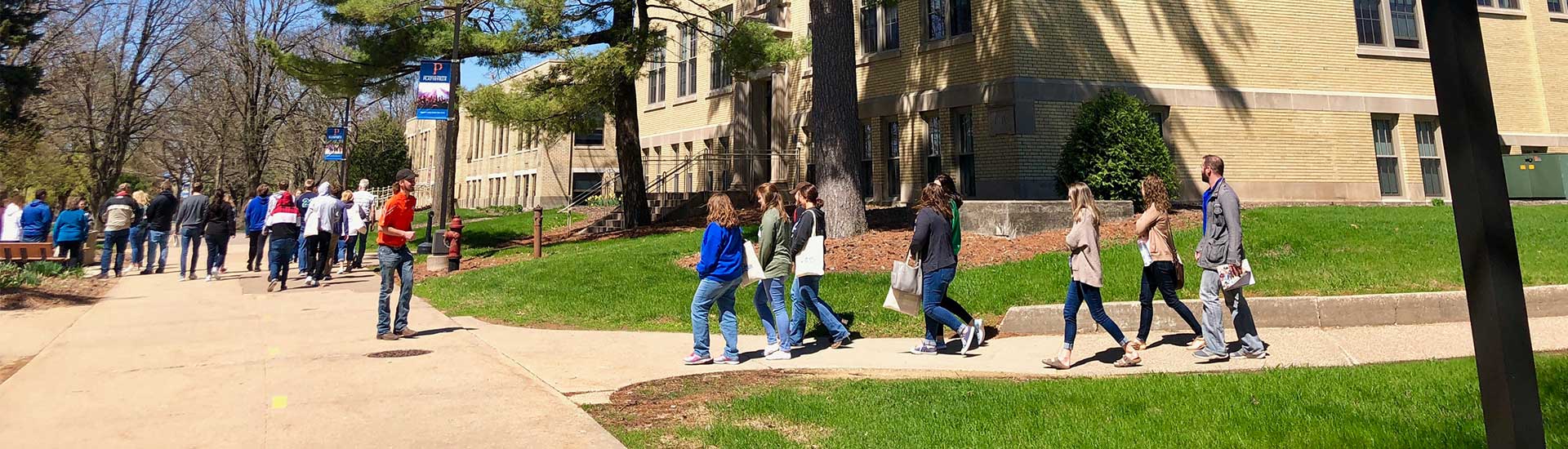 Spring campus students near Ullrich Hall
