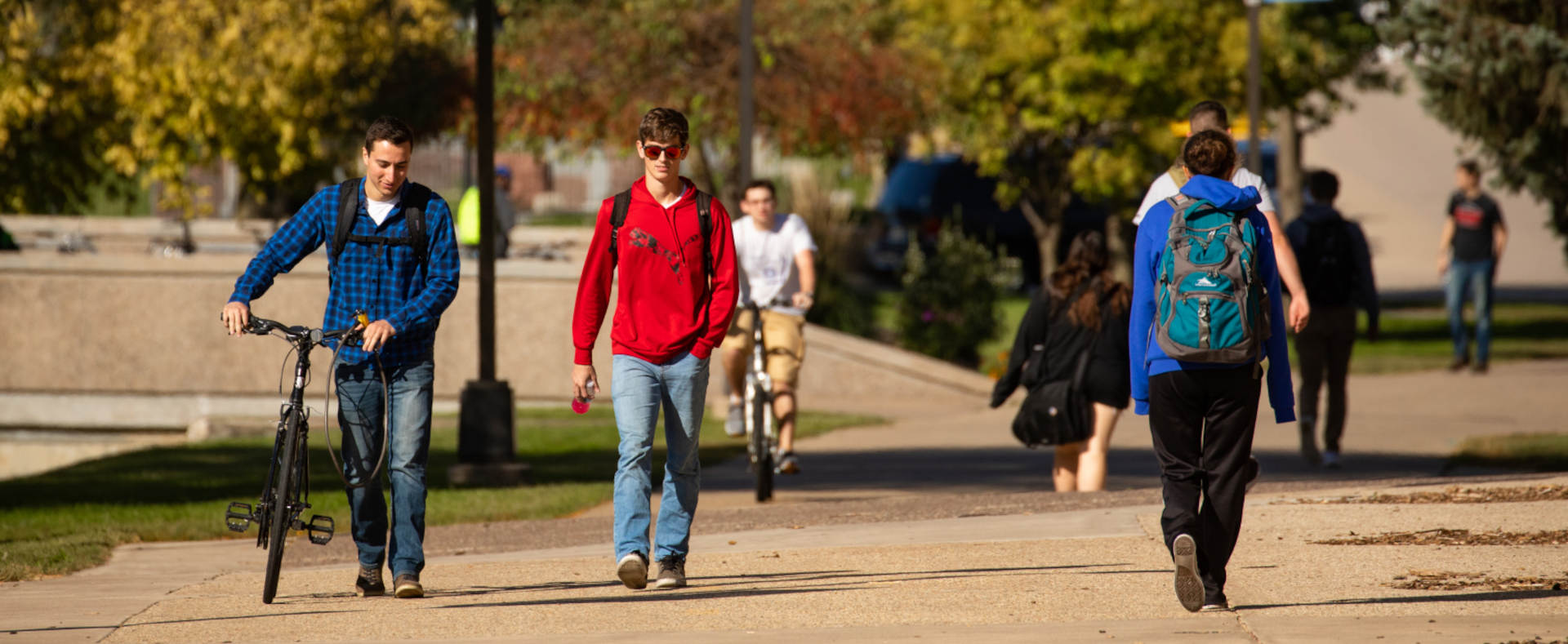 Students walking to class on a sidewalk