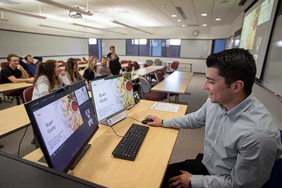 A UW-Platteville business student delivering a presentation